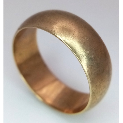 9 - A 9K Yellow Gold Band Ring. Full UK hallmarks. 8mm width. Size U. 6.9g.