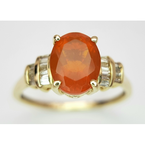 43 - A 14K Yellow Gold, Fire Opal and Diamond Ring. Oval cut 1.5ct fire opal with tapered baguette diamon... 
