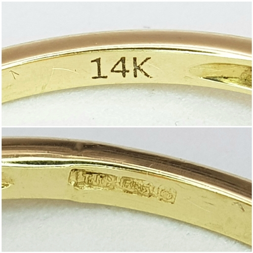 43 - A 14K Yellow Gold, Fire Opal and Diamond Ring. Oval cut 1.5ct fire opal with tapered baguette diamon... 