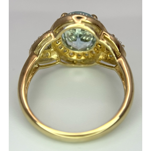 19 - A 14K Yellow Gold, Blue Topaz and Diamond Ring. 3ct oval cut, ice blue central topaz with 0.14ctw of... 