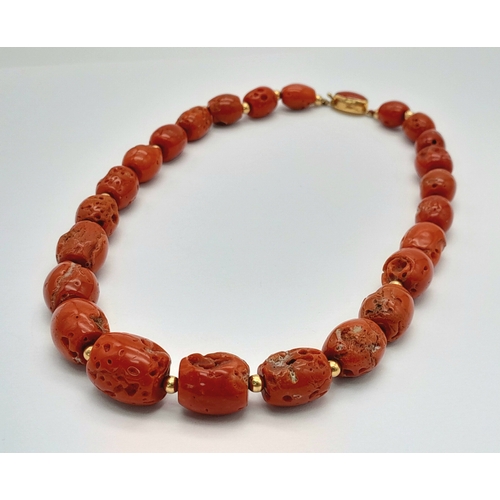 202 - A Vintage 18K Gold and Red Coral Necklace. Beautiful, natural graduating red coral rondelles with go... 