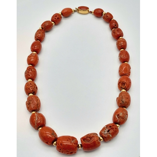 202 - A Vintage 18K Gold and Red Coral Necklace. Beautiful, natural graduating red coral rondelles with go... 