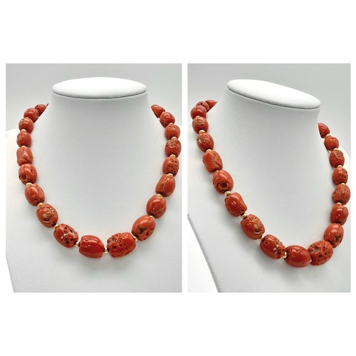 202 - A Vintage 18K Gold and Red Coral Necklace. Beautiful, natural graduating red coral rondelles with go... 