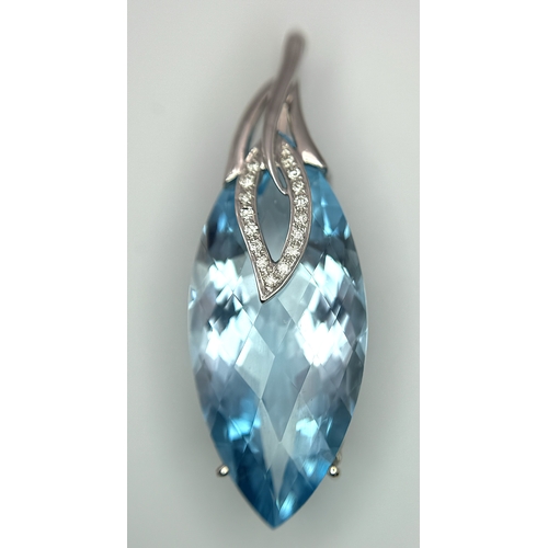 41 - A 20ct Marquise Cut Ice Blue Topaz in an 18K White Gold and Diamond Cage - Pendant. 7g total weight.... 