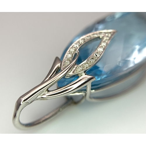 41 - A 20ct Marquise Cut Ice Blue Topaz in an 18K White Gold and Diamond Cage - Pendant. 7g total weight.... 