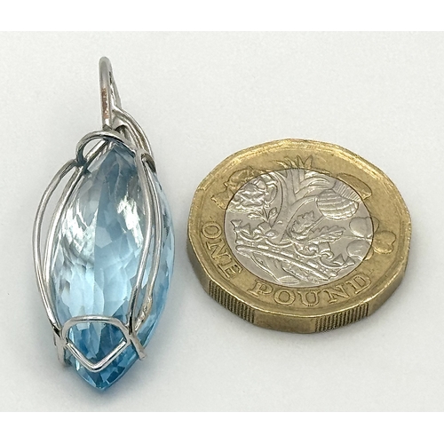 41 - A 20ct Marquise Cut Ice Blue Topaz in an 18K White Gold and Diamond Cage - Pendant. 7g total weight.... 