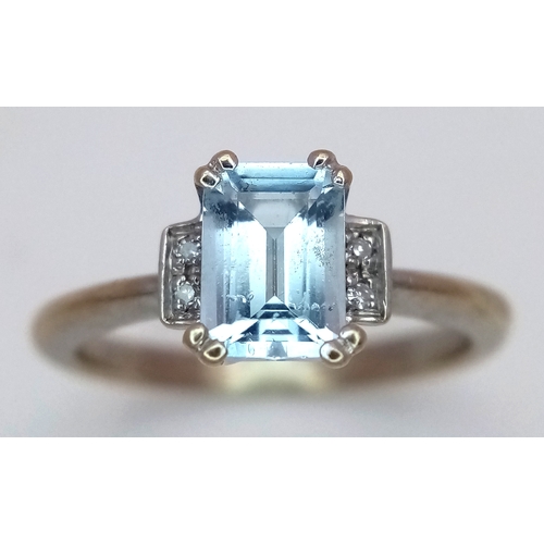 344 - A 9K Yellow Gold Emerald Cut Blue Topaz and Diamond Ring. 1ct centre stone with diamond accents. Siz... 