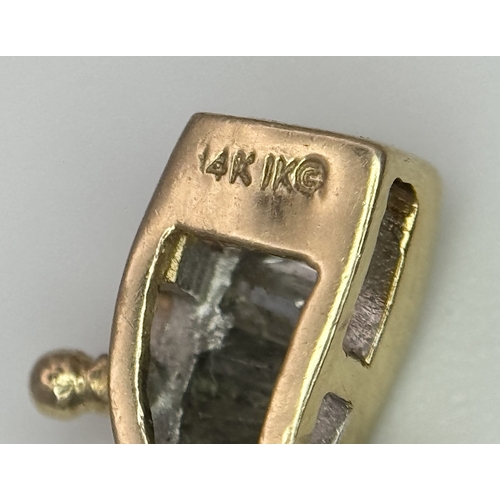 199 - A 14k Yellow Gold and Diamond Bracelet. Fifteen waves of tapered baguette cut diamonds - c.2.5ctw. 1... 