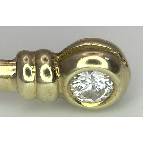 234 - A 9K Yellow Gold Cuff Bangle with White Stone Decoration. 3.1g total weight.