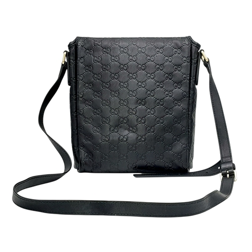 188 - A Gucci Black GG Messenger Guccissima Leather Crossbody Bag. Black Guccissima-embossed leather exter... 