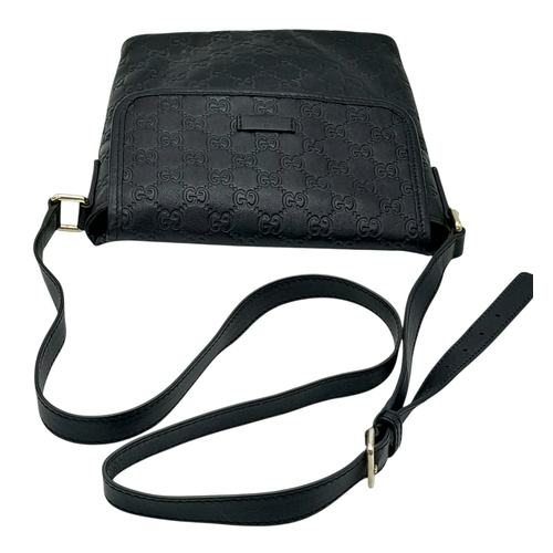188 - A Gucci Black GG Messenger Guccissima Leather Crossbody Bag. Black Guccissima-embossed leather exter... 