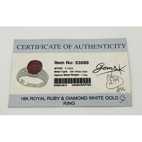 193 - An 18K White Gold, Royal Ruby and Diamond Ring. A 5.038 Madagascan oval cut Royal ruby with 0.084ctw... 