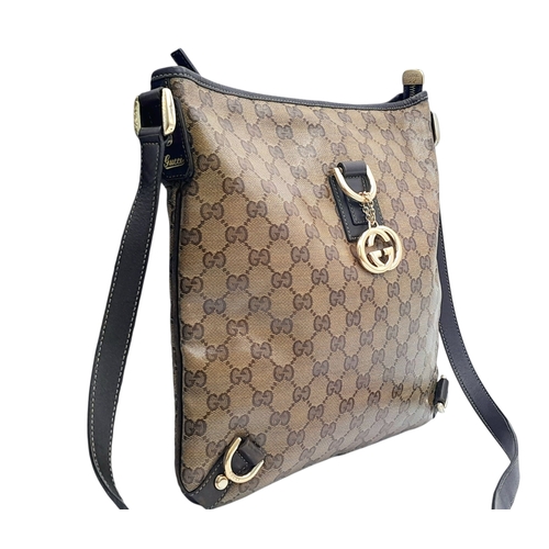 208 - A Gucci Brown GG Monogram Canvas Crossbody Bag. Brown GG monogram canvas exterior with gold-toned ha... 