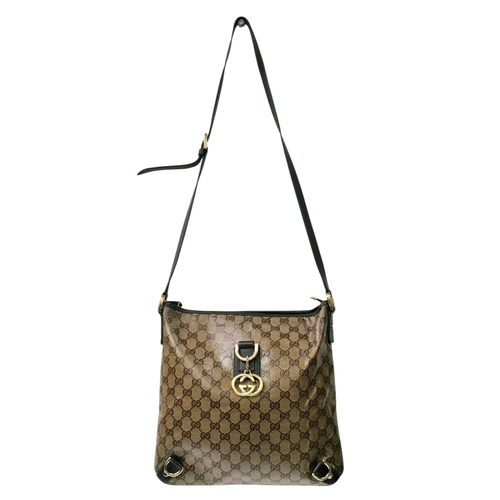 208 - A Gucci Brown GG Monogram Canvas Crossbody Bag. Brown GG monogram canvas exterior with gold-toned ha... 