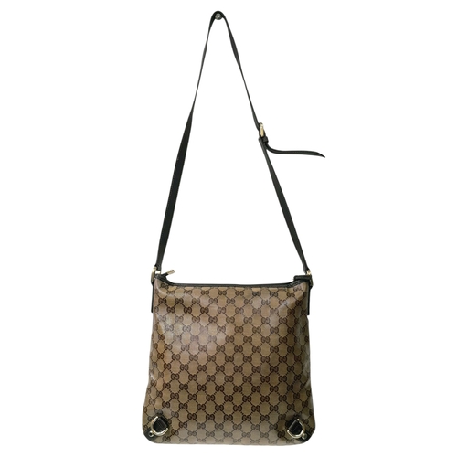208 - A Gucci Brown GG Monogram Canvas Crossbody Bag. Brown GG monogram canvas exterior with gold-toned ha... 