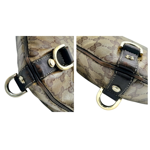 208 - A Gucci Brown GG Monogram Canvas Crossbody Bag. Brown GG monogram canvas exterior with gold-toned ha... 