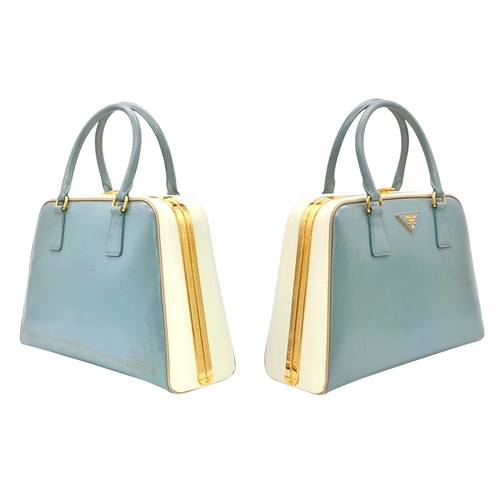 258 - A Prada Pale Green Saffiano Leather Frame Bag. Pale green saffiano leather exterior with gold-toned ... 