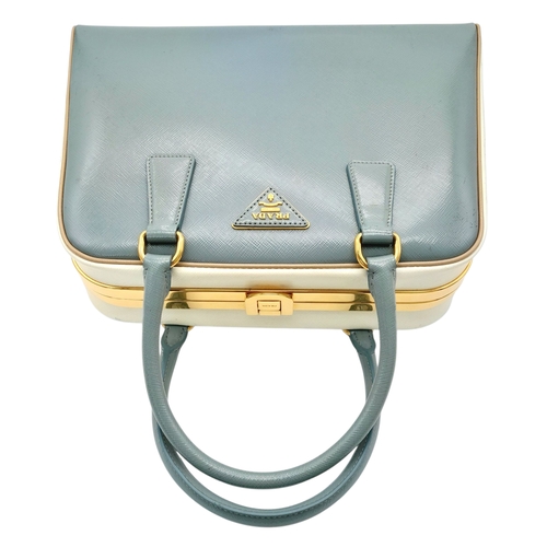 258 - A Prada Pale Green Saffiano Leather Frame Bag. Pale green saffiano leather exterior with gold-toned ... 