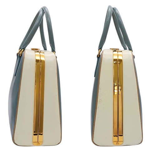 258 - A Prada Pale Green Saffiano Leather Frame Bag. Pale green saffiano leather exterior with gold-toned ... 