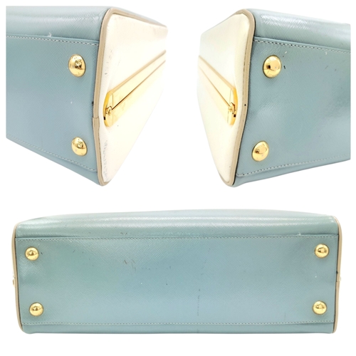 258 - A Prada Pale Green Saffiano Leather Frame Bag. Pale green saffiano leather exterior with gold-toned ... 