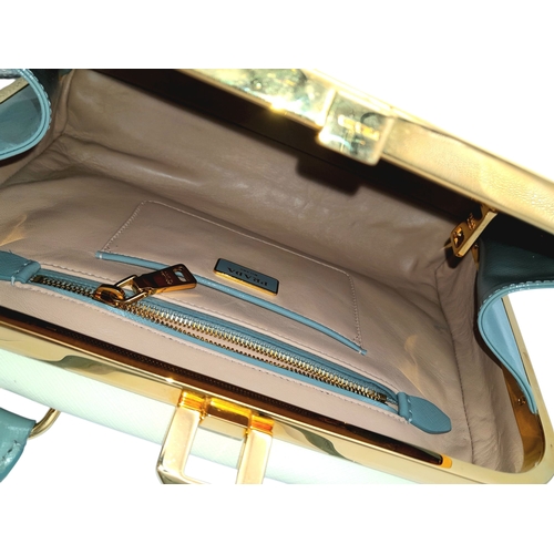 258 - A Prada Pale Green Saffiano Leather Frame Bag. Pale green saffiano leather exterior with gold-toned ... 