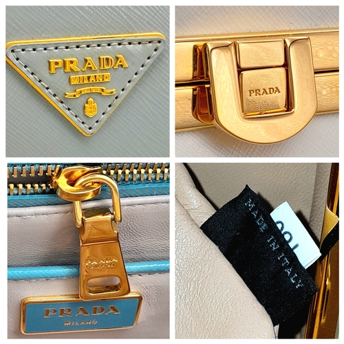 258 - A Prada Pale Green Saffiano Leather Frame Bag. Pale green saffiano leather exterior with gold-toned ... 
