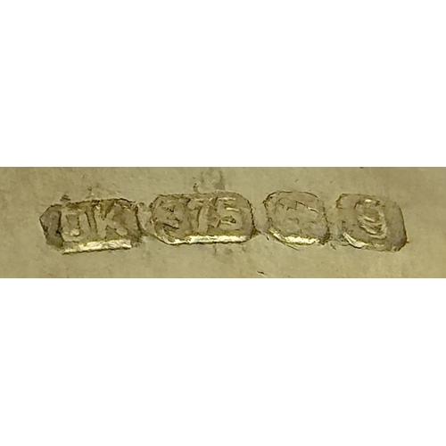 262 - A 9K Yellow Gold, London Blue Topaz and Diamond Ring. A 5.979ct, oval cut topaz with 0.056ct of Diam... 