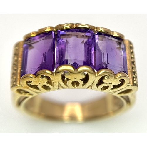 269 - A 9K Yellow Gold Amethyst Ring. Three Uruguayan Octagon Cut Amethysts - 3.505ctw. Size M 1/2. 6.53g ... 