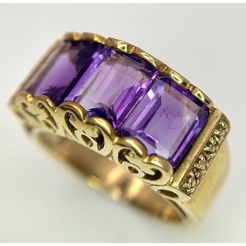 269 - A 9K Yellow Gold Amethyst Ring. Three Uruguayan Octagon Cut Amethysts - 3.505ctw. Size M 1/2. 6.53g ... 