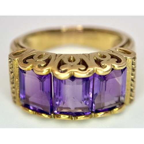 269 - A 9K Yellow Gold Amethyst Ring. Three Uruguayan Octagon Cut Amethysts - 3.505ctw. Size M 1/2. 6.53g ... 