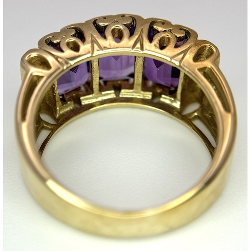269 - A 9K Yellow Gold Amethyst Ring. Three Uruguayan Octagon Cut Amethysts - 3.505ctw. Size M 1/2. 6.53g ... 