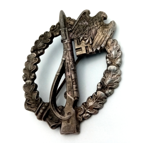 271 - WW2 German Infantry Assault Badge. This is a zinc based struck solid backed example. Maker marked ‘G... 