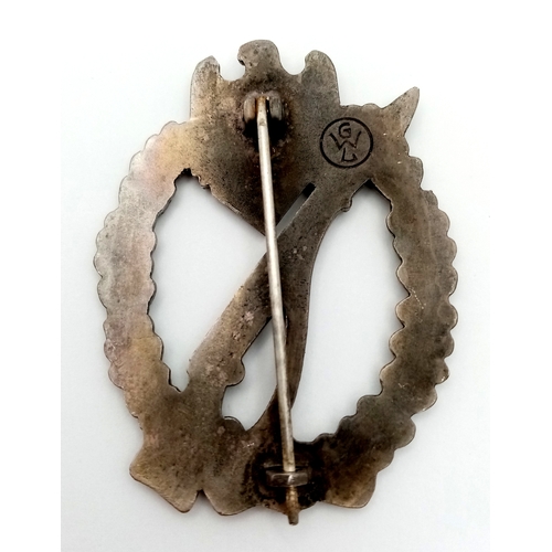 271 - WW2 German Infantry Assault Badge. This is a zinc based struck solid backed example. Maker marked ‘G... 
