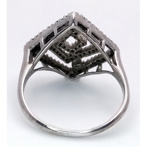 288 - A 9K WHITE GOLD DIAMOND SET ABSTRACT DESIGN RING. 3.5G TOTAL WEIGHT, SIZE P. Ref: SC 2047