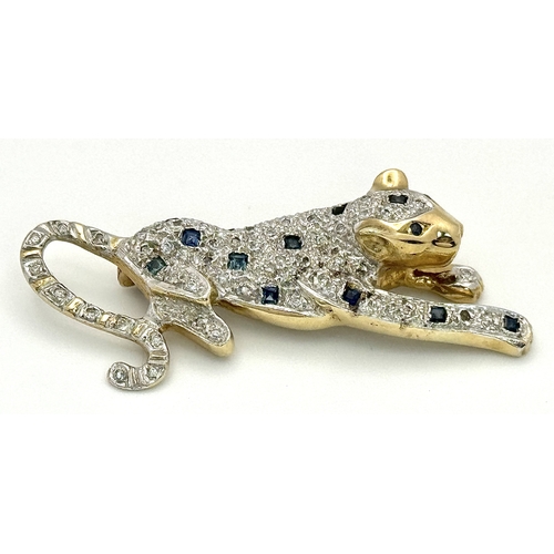 304 - A Playful 9K Gold, Diamond and Sapphire Panther Brooch. 1ctw of diamonds and 0.5ctw of sapphires. 5c... 
