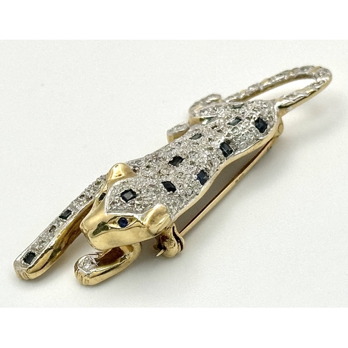 304 - A Playful 9K Gold, Diamond and Sapphire Panther Brooch. 1ctw of diamonds and 0.5ctw of sapphires. 5c... 