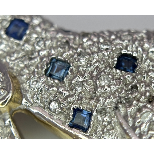 304 - A Playful 9K Gold, Diamond and Sapphire Panther Brooch. 1ctw of diamonds and 0.5ctw of sapphires. 5c... 