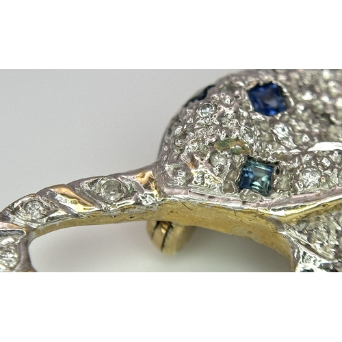 304 - A Playful 9K Gold, Diamond and Sapphire Panther Brooch. 1ctw of diamonds and 0.5ctw of sapphires. 5c... 