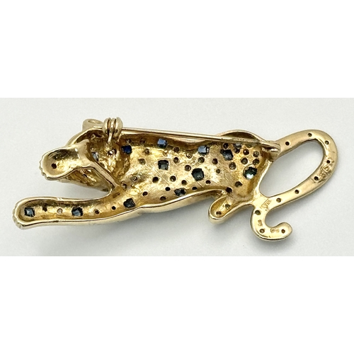 304 - A Playful 9K Gold, Diamond and Sapphire Panther Brooch. 1ctw of diamonds and 0.5ctw of sapphires. 5c... 