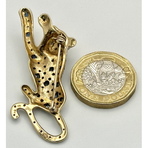 304 - A Playful 9K Gold, Diamond and Sapphire Panther Brooch. 1ctw of diamonds and 0.5ctw of sapphires. 5c... 
