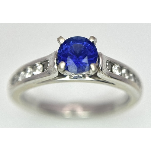 318 - A 14K White Gold, Sapphire and Diamond Ring. 0.35ct centre stone. Size I. 3g total weight. N28/33005... 