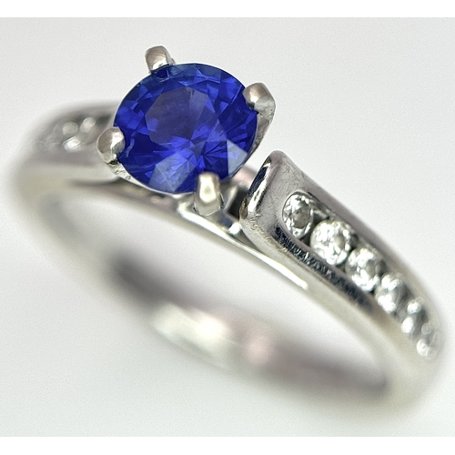 318 - A 14K White Gold, Sapphire and Diamond Ring. 0.35ct centre stone. Size I. 3g total weight. N28/33005... 
