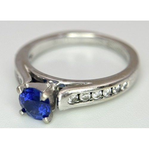 318 - A 14K White Gold, Sapphire and Diamond Ring. 0.35ct centre stone. Size I. 3g total weight. N28/33005... 