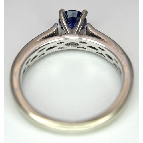 318 - A 14K White Gold, Sapphire and Diamond Ring. 0.35ct centre stone. Size I. 3g total weight. N28/33005... 