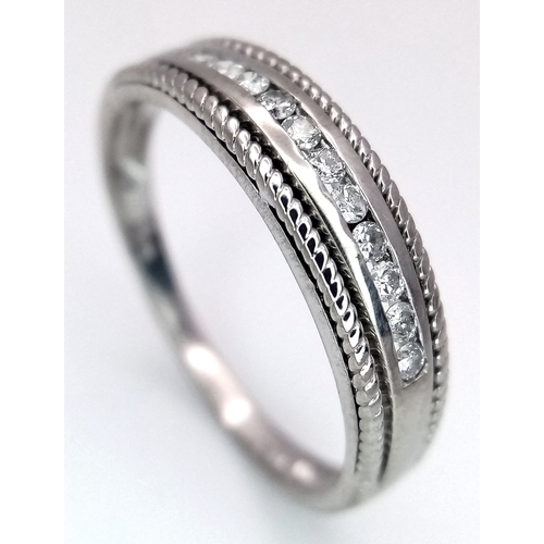 330 - A 9K WHITE GOLD WITH YELLOW GOLD BEADED EDGE DIAMOND SET BAND RING. 0.15CTW, 2.2G TOTAL WEIGHT, SIZE... 