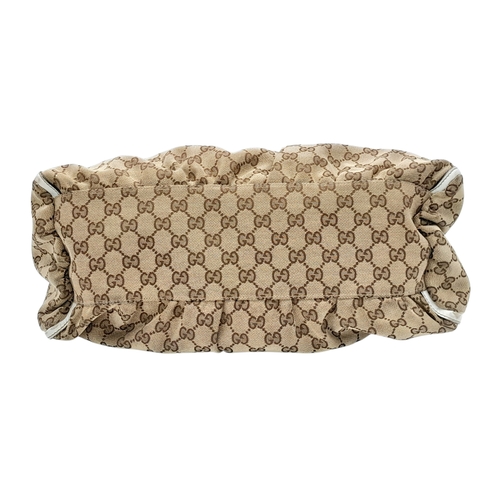 334 - A Gucci Brown GG Canvas and White Leather Abbey Shoulder Bag. Brown GG monogram canvas exterior with... 