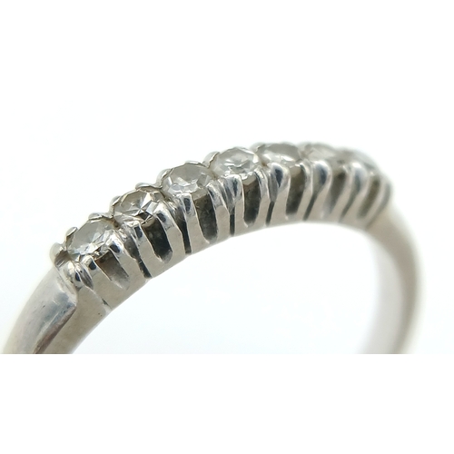 360 - 14 Carat White Gold Seven Diamond Ring Size M. The Ring is set with Seven 1.5mm Round Cut Diamonds. ... 