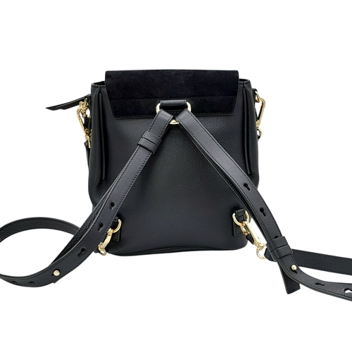 16 - A Chloe Faye Medium Backpack in Black and Suede. Black leather and suede exterior with gold-toned ha... 