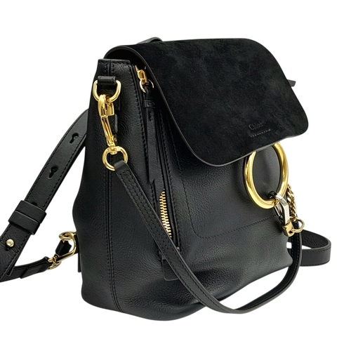 16 - A Chloe Faye Medium Backpack in Black and Suede. Black leather and suede exterior with gold-toned ha... 