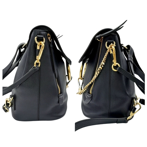 16 - A Chloe Faye Medium Backpack in Black and Suede. Black leather and suede exterior with gold-toned ha... 